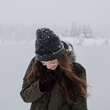 Woman walking through a blizzard