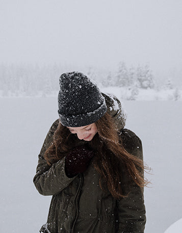 Woman walking through a blizzard
